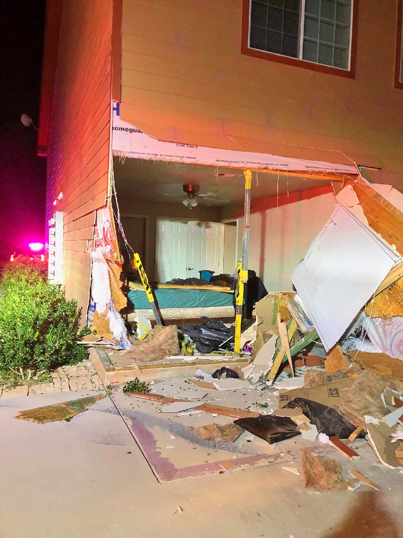 Truck busts through wall of apartment